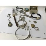 A collection of silver jewellery including bracele