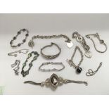 Twelve silver bracelets, various styles.