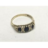 A Vintage gold ring set with sapphire and chip sto