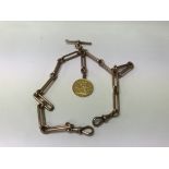 A 9 ct gold watch chain with attached 1887 full so