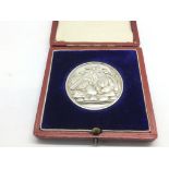 A boxed silver gardening medal.