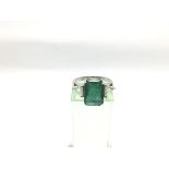 An 18ct white gold emerald cut emerald and rose cu