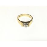 A heavy 18 ct gold diamond single stone ring. Size