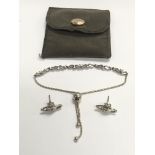 A pair of Vivienne Westwood earrings and a Pandora bracelet.