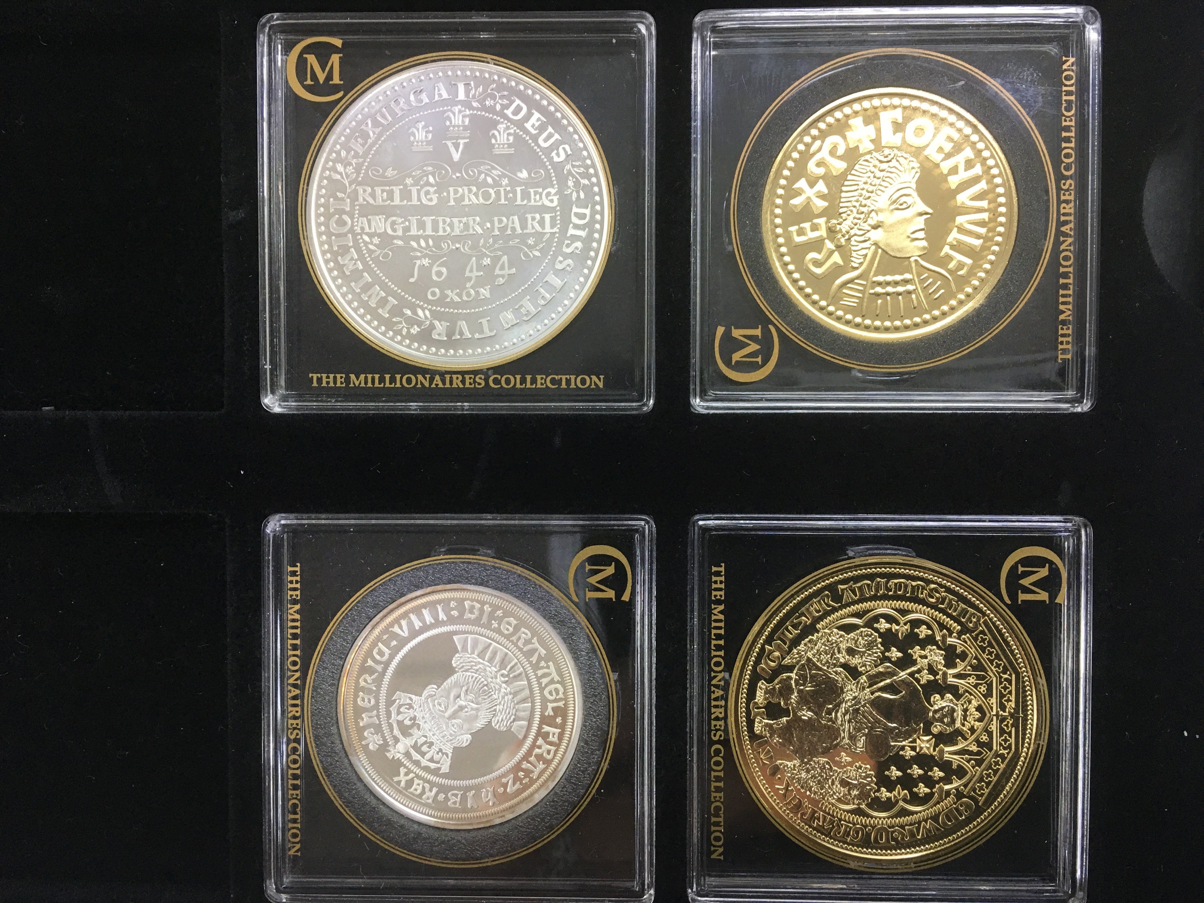 Four silver and gold plated proof coins from the Millionaires collection with COA ps comprising