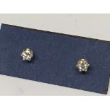 A pair of diamond stud earrings