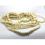 Two good size antique ivory necklaces and one cons