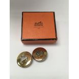 A pair of Hermes clip on earrings.