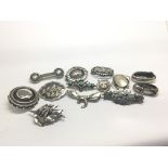 A collection of silver brooches and other unmarked