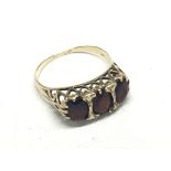 An Antique 9carat gold ring set with three garnets