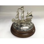 A boxed sterling silver model of Francis Drake's 'The Golden Hind' with COA and related paperwork,