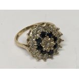 A sapphire and diamond cluster ring. Ring size P