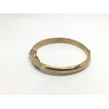 A 9ct gold bangle, approx 10.8g.