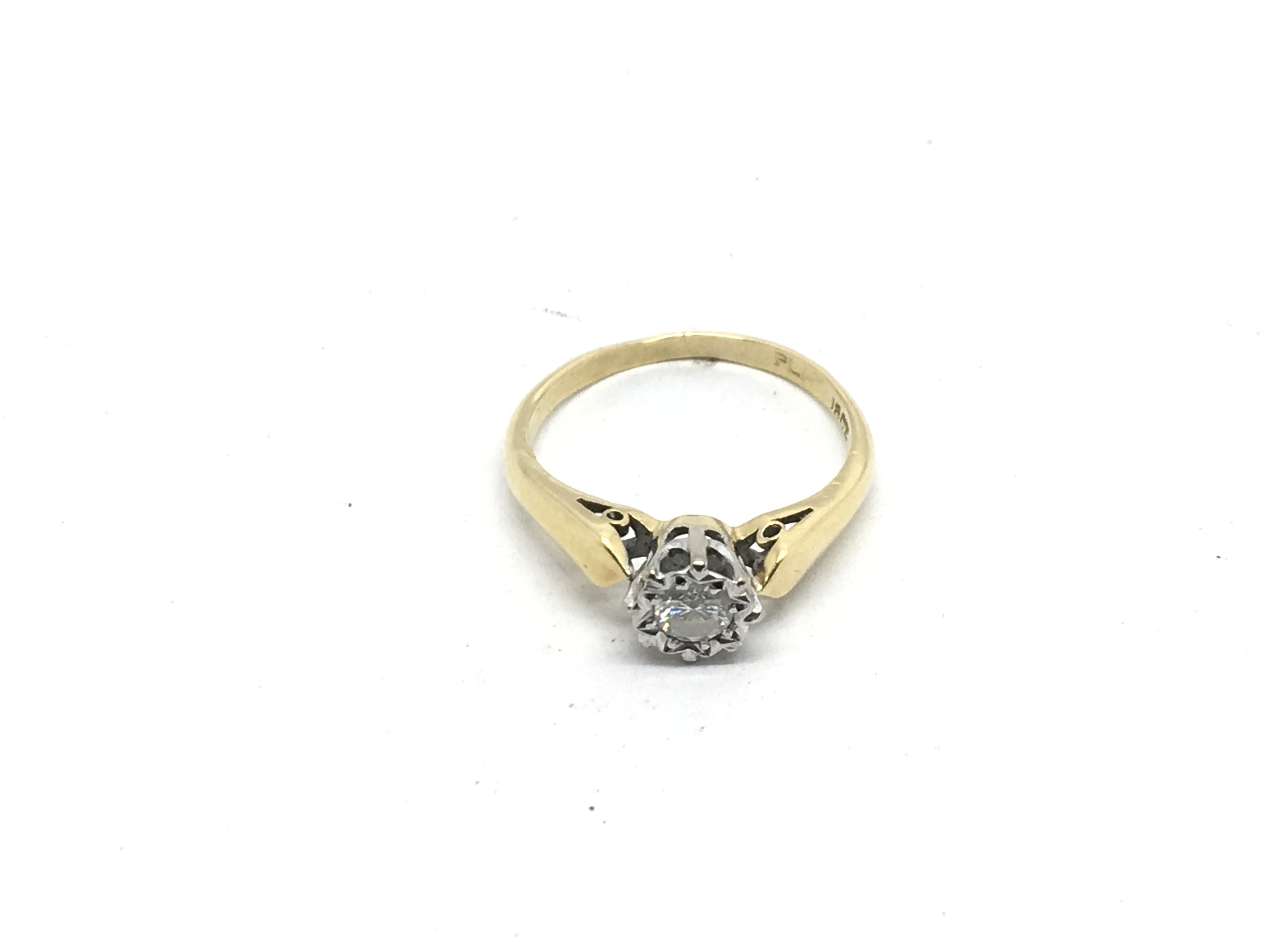 An 18ct gold solitaire diamond ring, approx .25 po