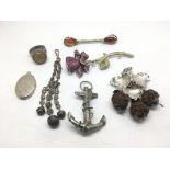 A bag of silver jewellery comprising brooches, a r