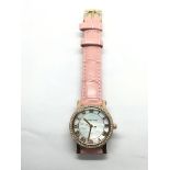 A ladies Michael Kors watch with mother of pearl e