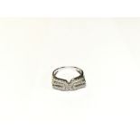 A modern style 14ct white gold diamond set ring. S