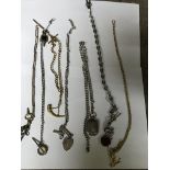 A collection of 7 watch chains including silver-an
