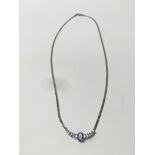 A 14ct white gold necklace set with a tanzanite.