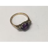 A 9 ct gold Ring inset with amethyst stone flanked by diamonds. Size M - NO RESERVE