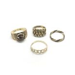 Four gold rings, total weight approx 9.6g.