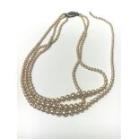 A Three string Pearl necklace, boxed. A/f as pictured - NO RESERVE
