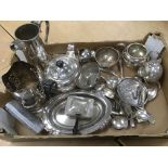 A box of silver plated items.