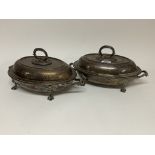 A pair of matching silver plated entree dishes and