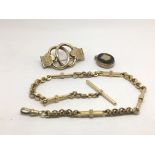A yellow metal Albert chain, brooch and mourning l
