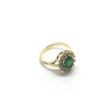 An 18ct gold emerald and diamond ring, approx 3.8g