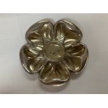 A hallmarked silver poppy design pin dish by Elkington & Co Ltd, London 1900 inset with a 1901