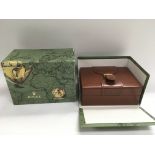 A Rolex watch box with outer case.