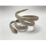 An unusual white woven metal snake bangle.