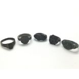 A collection of bronze Roman rings including one with a well polished rectangular bezel and others