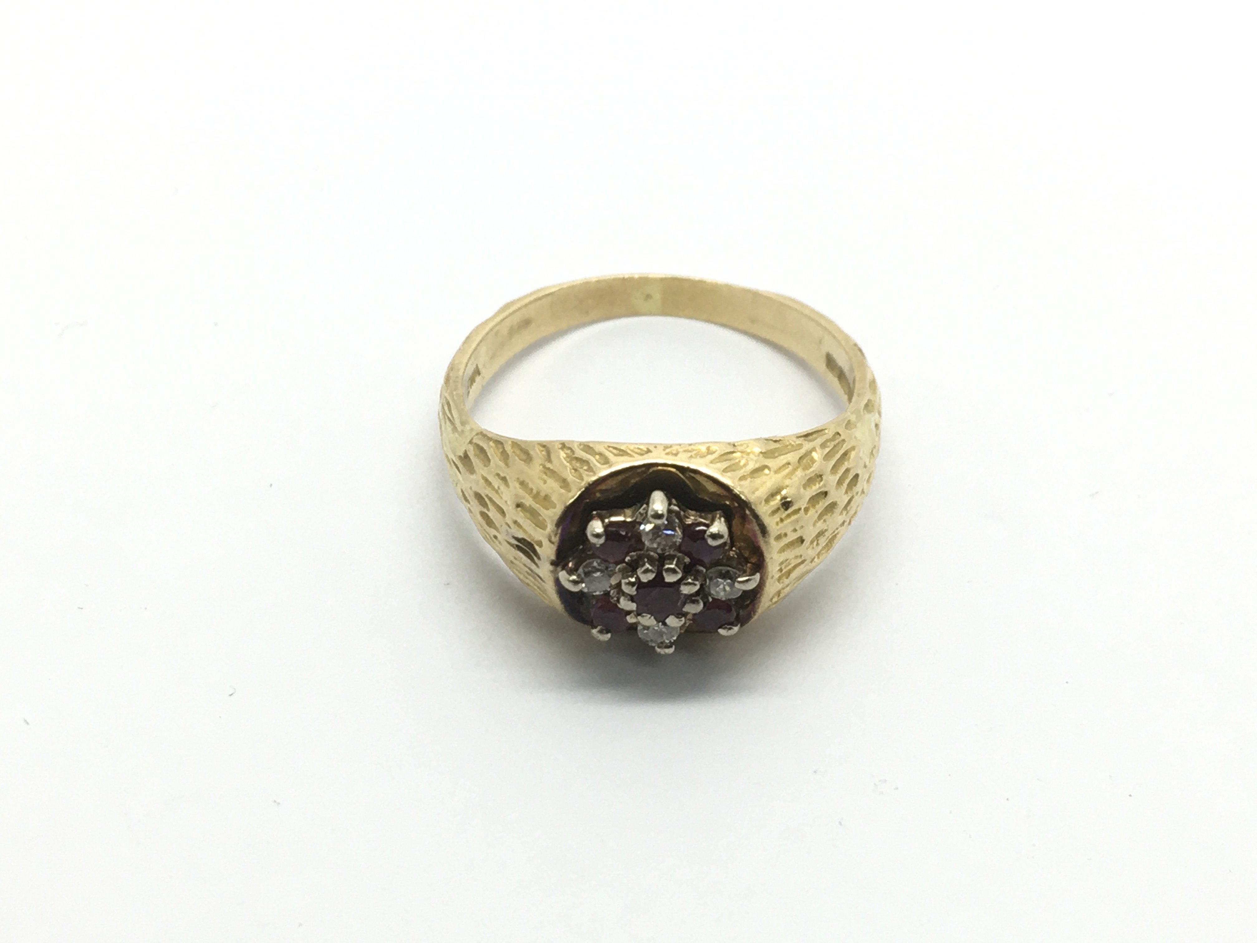 An 18ct gold ring set with rubies and diamonds, ap