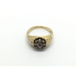 An 18ct gold ring set with rubies and diamonds, ap