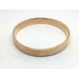 A 9ct gold bangle, approx 12.7g.