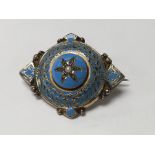 A Victorian enamel mourning brooch inset with seed