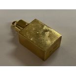 A small 9ct gold perfume bottle. 8.9g.