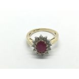 A 9ct gold, oval ruby and diamond cluster ring, ru