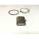 Two Silver Bangles and a Silver Vesta.