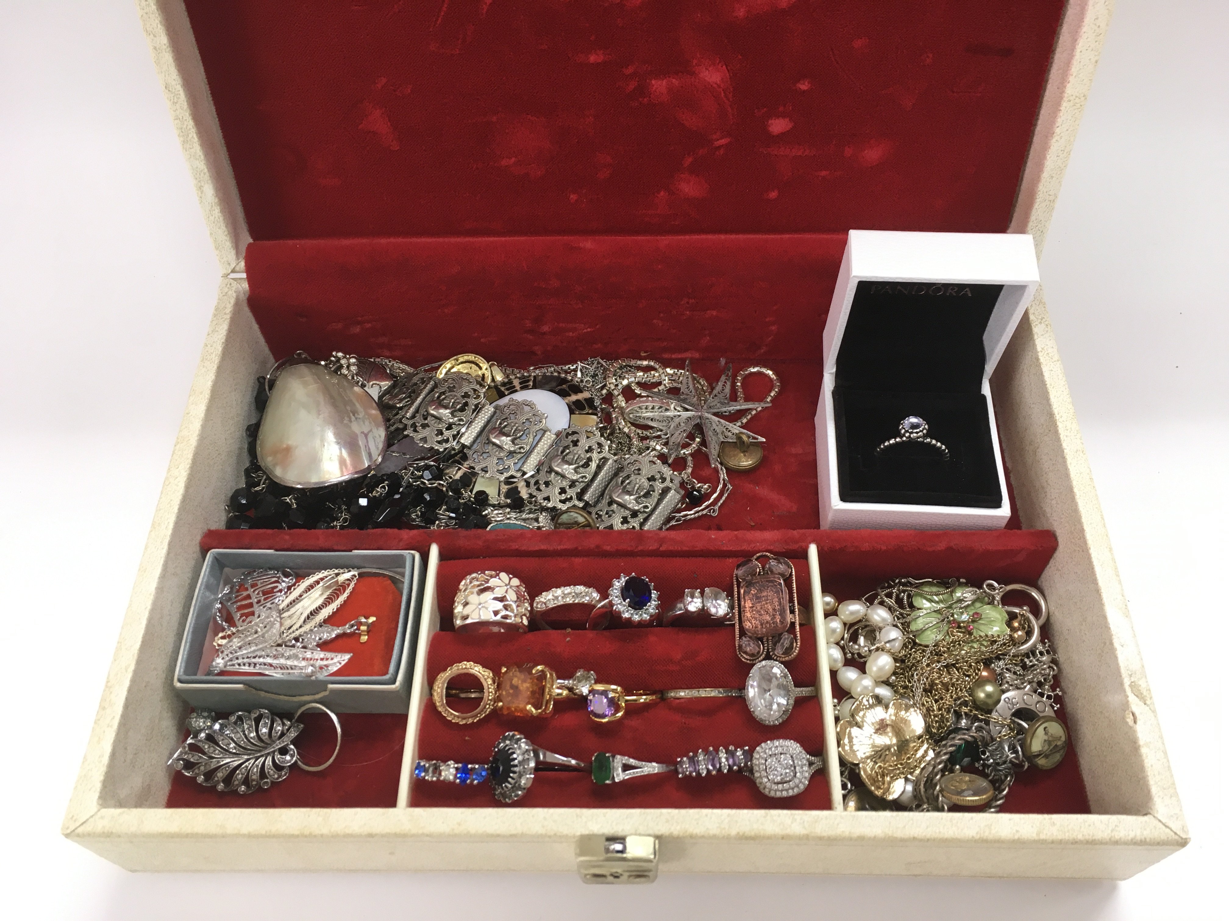 A jewellery box of silver and other jewellery item