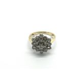 An 18ct gold diamond cluster ring, approx 6.7g and