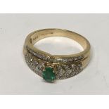 An unusual emerald and diamond ring. Ring size Q