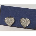 A pair of Pave set diamond heart studs with screw