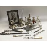 A collection of silver to include candlesticks, ph