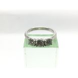 A certificated 18ct white gold three stone diamond