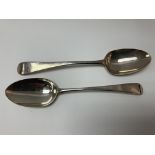 A pair of Georgian silver serving spoons.