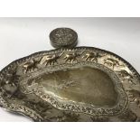A white metal silver tray decorated with Elephants and a silver Indian compact .