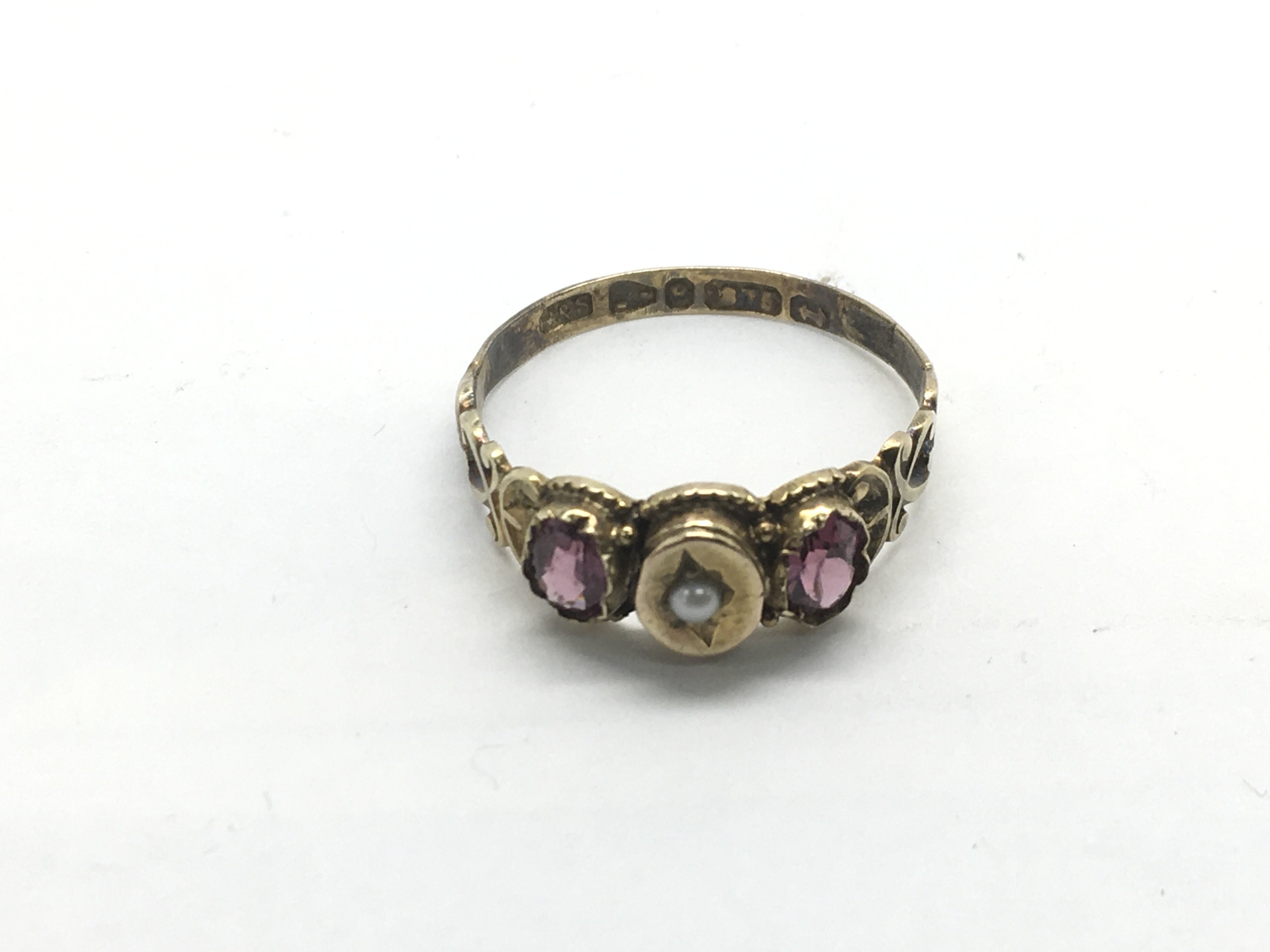 A Victorian 9ct gold garnet and pearl ring, approx